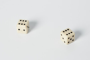 Two white dice on a white isolated background
