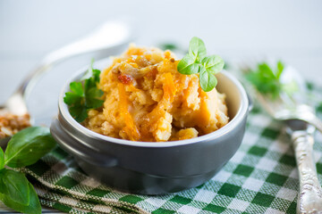 Cooked pea porridge with spices and seasonings in a ceramic bowl .