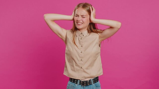 Dont want to hear and listen. Frustrated annoyed irritated woman covering ears gesturing No, avoiding advice ignoring unpleasant noise loud voices. Blonde girl isolated alone on pink background