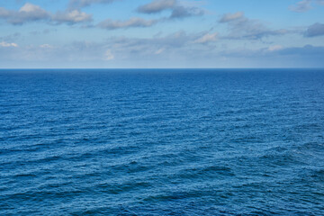 Fototapeta premium Cold winter ocean and clouds of Pacific oceanblue sea and sky in winter