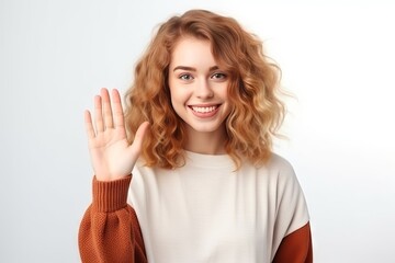 Friendly smiling white girl waving hand to say hi, greeting someone. over isolated white background 