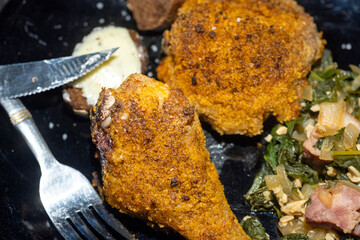 Southern fried chicken and mustard greens dinner.