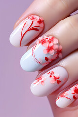 Woman's fingernails with floral nail art design