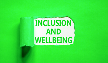 Inclusion and wellbeing symbol. Concept words Inclusion and wellbeing on beautiful white paper. Beautiful green background. Motivational inclusion and wellbeing concept. Copy space.