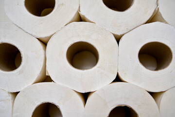 White toilet paper on a bathroom shelf.