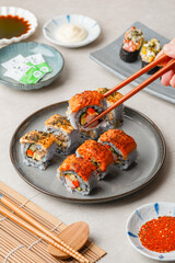 sushi is a Japanese dish of prepared vinegared rice, usually with some sugar and salt, accompanied by a variety of ingredients such as seafood, often raw and vegetables.