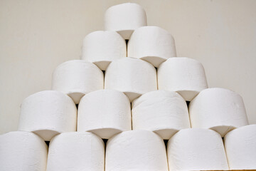 White toilet paper on a bathroom shelf.
