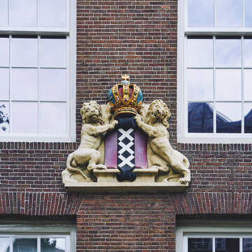 Royal lions holding a crown in Amsterdam.