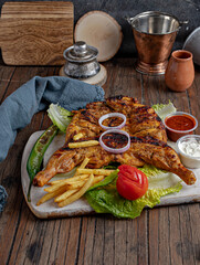 charcoal grilled chicken with fries
