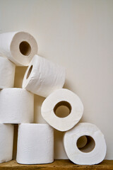 White toilet paper on a bathroom shelf.