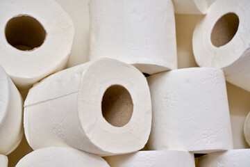 White toilet paper on a bathroom shelf.