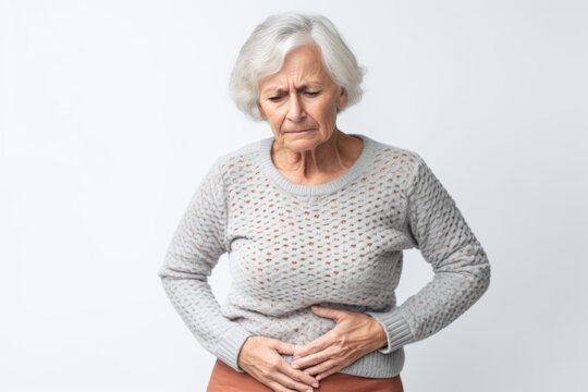 Senior woman suffering from stomach ache. Health care and medicine concept.