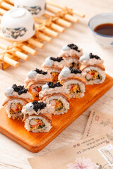 sushi is a Japanese dish of prepared vinegared rice, usually with some sugar and salt, accompanied by a variety of ingredients such as seafood, often raw and vegetables.