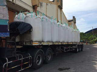 Chemical fertilizer Urea Stock pile jumbo-bag in a warehouse waiting for shipment.	
