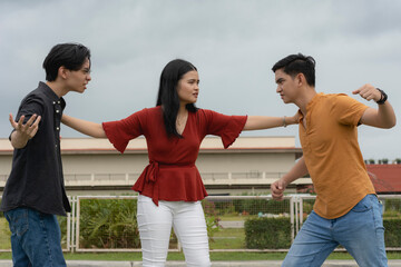A young asian lady tries to mediate between two rival suitors to stop them from fighting each...