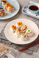 sushi is a Japanese dish of prepared vinegared rice, usually with some sugar and salt, accompanied by a variety of ingredients such as seafood, often raw and vegetables.