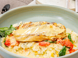 Close up shot of delicious risotto with fish steak