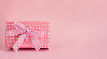 pink gift box with white dots