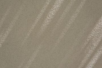 Fototapeta na wymiar Minimalist natural sustainable background, business brand template. Aesthetic neutral dark beige blank concrete wall texture with long abstract sunlight shadow pattern