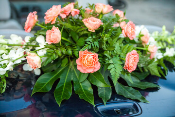 Pink and white flowers on car