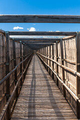 Diminishing perspective of wooden bridge