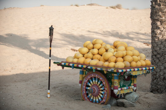 Cart of melons beside beach in Dubai, United Arab Emirates