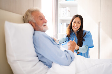 Nurse or doctor give man support during recovery, Caregiver holding hand of senior male patient, showing kindness while doing a checkup at a retirement health insurance, old age at home or hospital