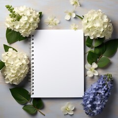 hydrangea flowers and notebook on wooden table, flat lay