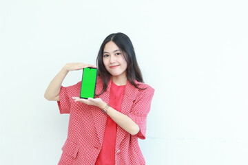 portrait of beautiful asian woman wearing red outfit holding mobile phone and smiling