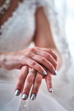 A bride shows her delicate hands