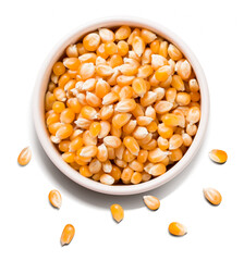 raw corn kernels in a white bowl isolated 