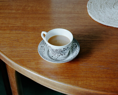 Tea cup and saucer on table