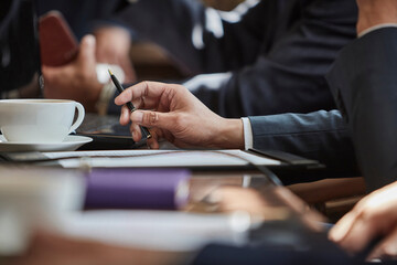 Hand of businessman holding pen