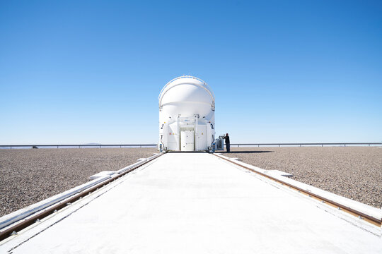 Scientist inspecting telescope at Paranal Observatory in Chile