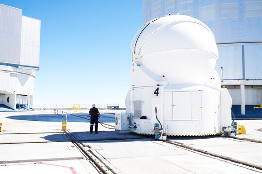 Scientist inspecting telescope at Paranal Observatory in Chile