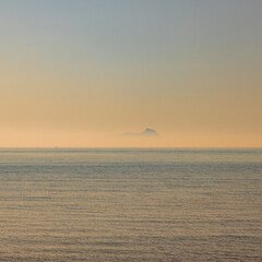 Ponza, Italy. The silhouette of the island emerging from the fog, seen from the Lazio coast in the...