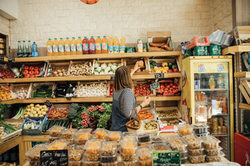 Young woman shopping in fruit and vegetable store