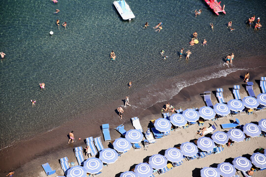 View directly above rows of umbrellas on beach