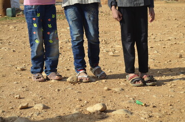 Syrian children with no proper shoes for winter