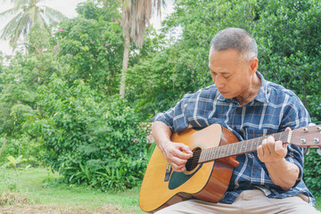 middle-aged man playing guitar