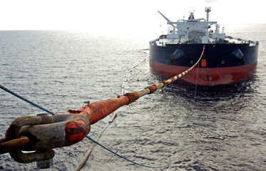 Oil tanker moored to oil rig