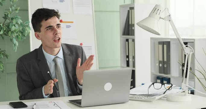 Energetic entrepreneur is shown singing and dancing at his work desk. With high spirits and infectious enthusiasm, he turns his workspace into a joyful dance floor.