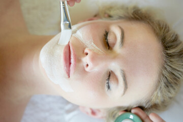 Young woman having beauty mask applied in Ko Samui, Thailand