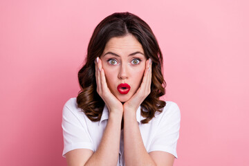 Photo of impressed funky young lady wear white shirt arms cheeks isolated pink color background