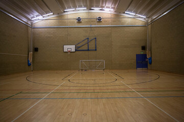 Sports gymnasium with basketball hoop court and soccer net 