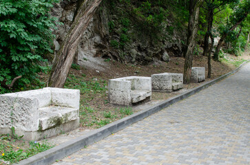 an old stone bench in the park
