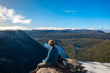 Fototapeta premium person on the top of the mountain
