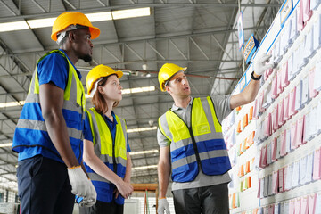 Warehouse Industrial supply chain and Logistics Companies inside. Warehouse workers checking the inventory. Products on inventory shelves storage. Worker Doing Inventory in Warehouse.