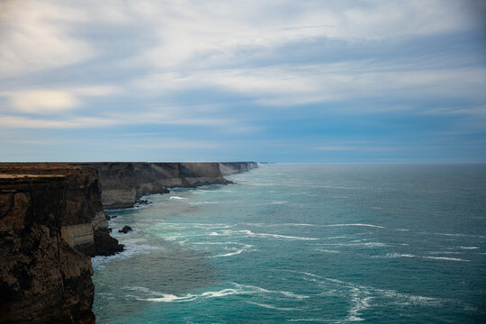Jarring cliffs above turquoise sea