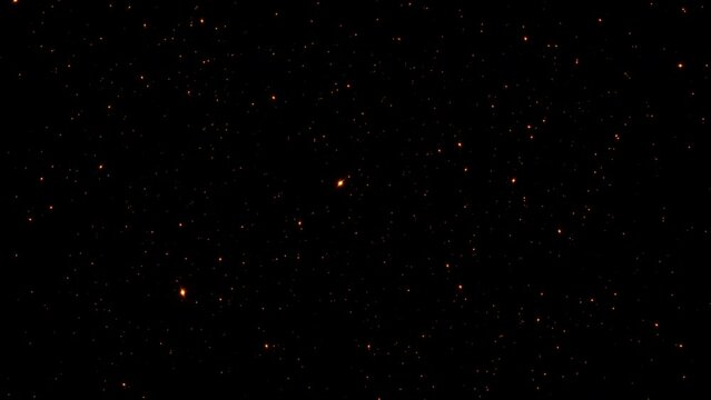 Loop glow flicker orange red stars particles animation on black abstract background flow to front for screen project overlay.Effect loop with galaxy sky particles twinkling light 